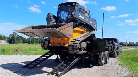 how to load skid steer on trailer|securing skid steer on trailer.